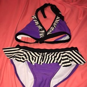 purple swimsuit runs a little big.